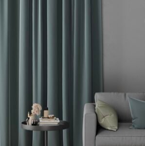 Dark green block-out curtains in a modern Auckland living room