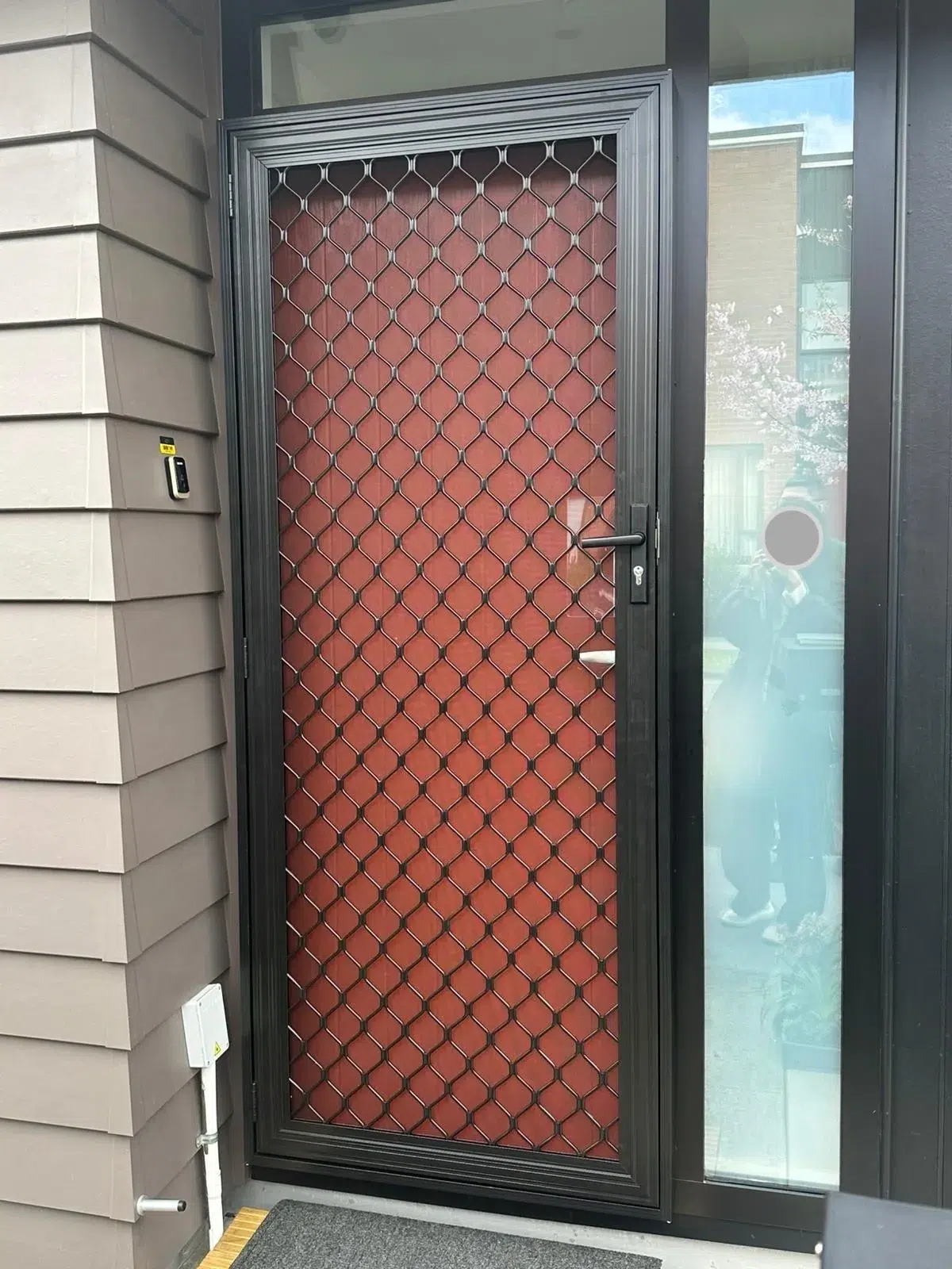 Diamond grille security screen door installed in Auckland