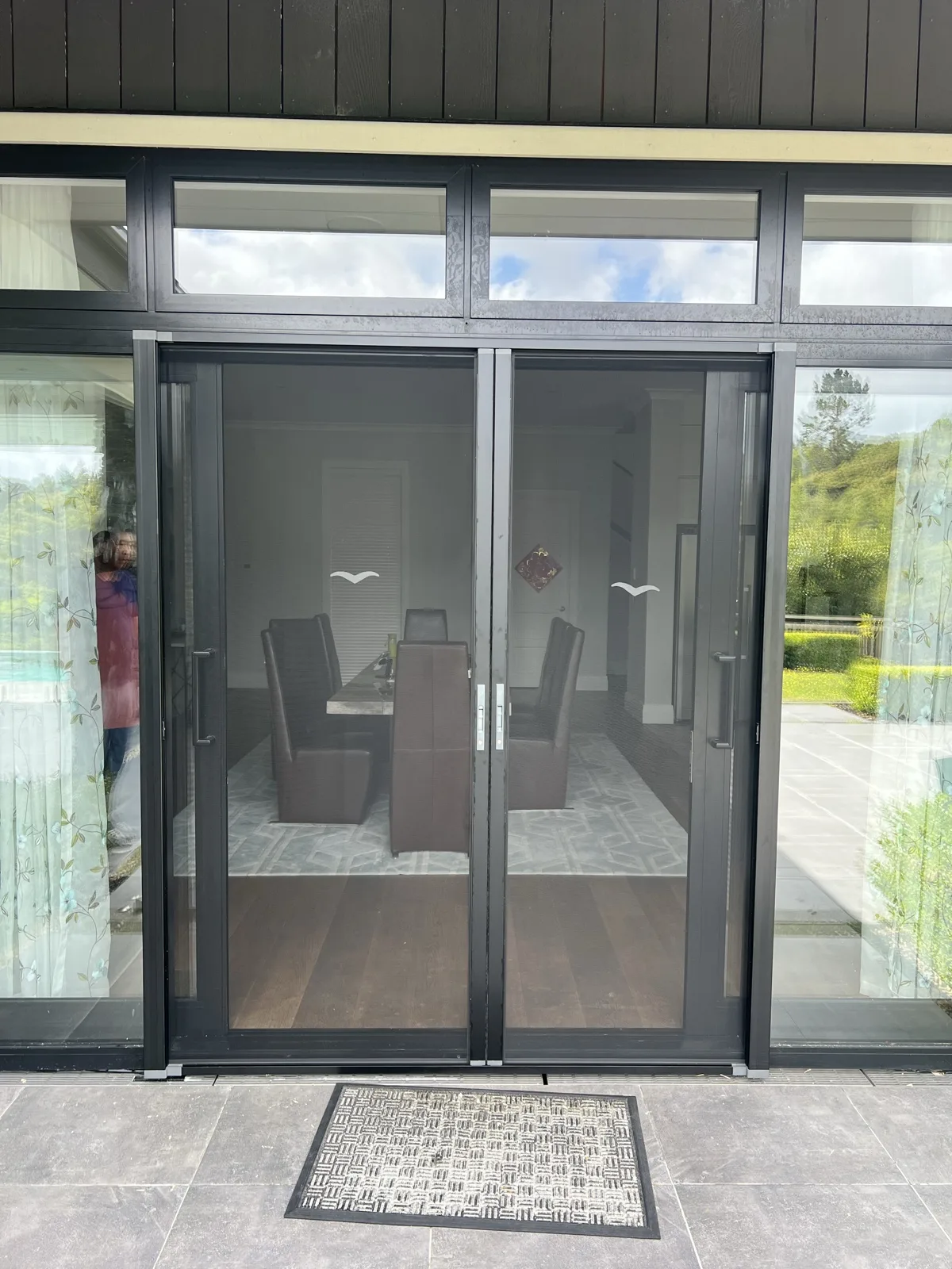 Double pleated screen doors closed
