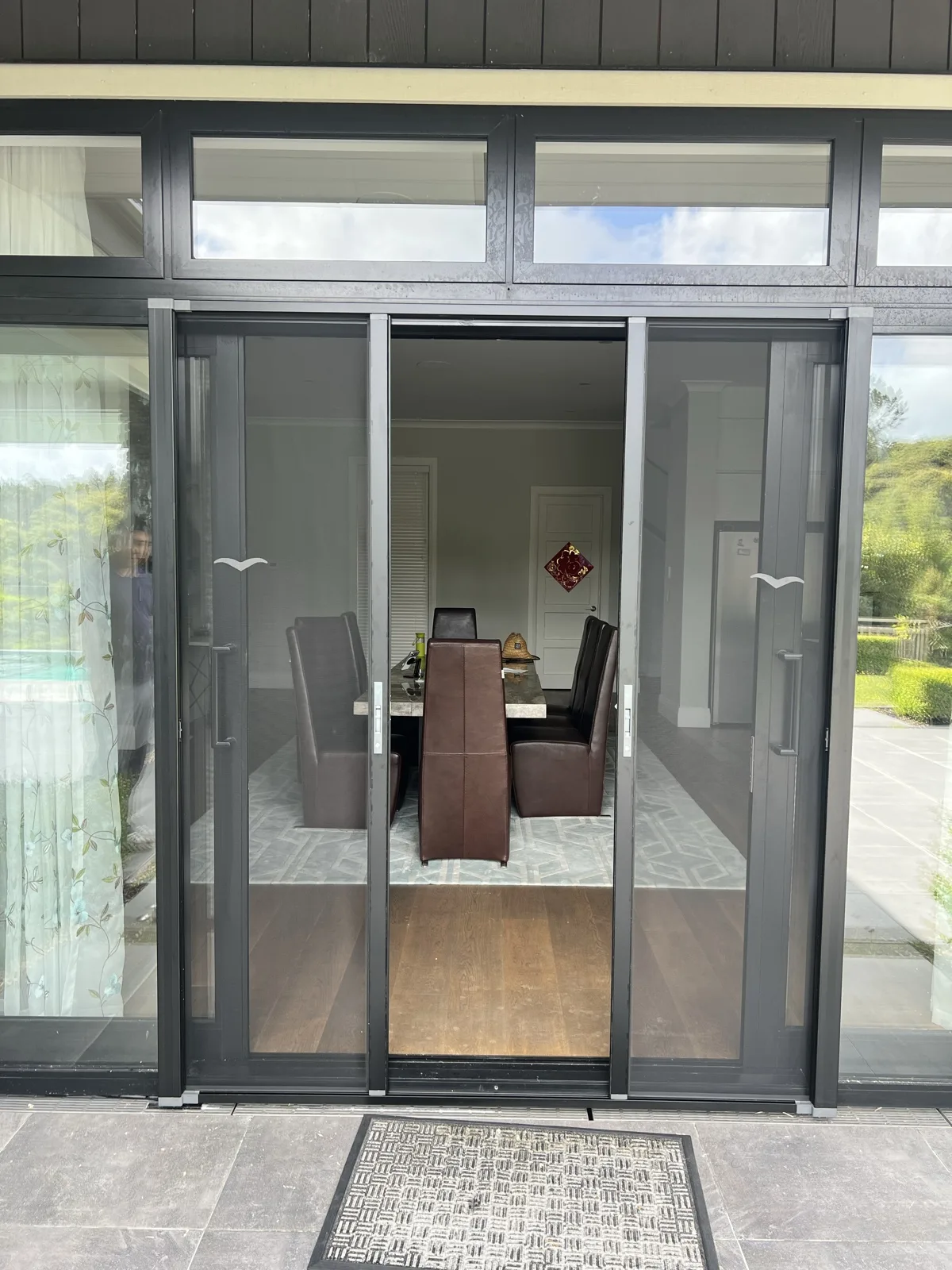 Double pleated screen doors open