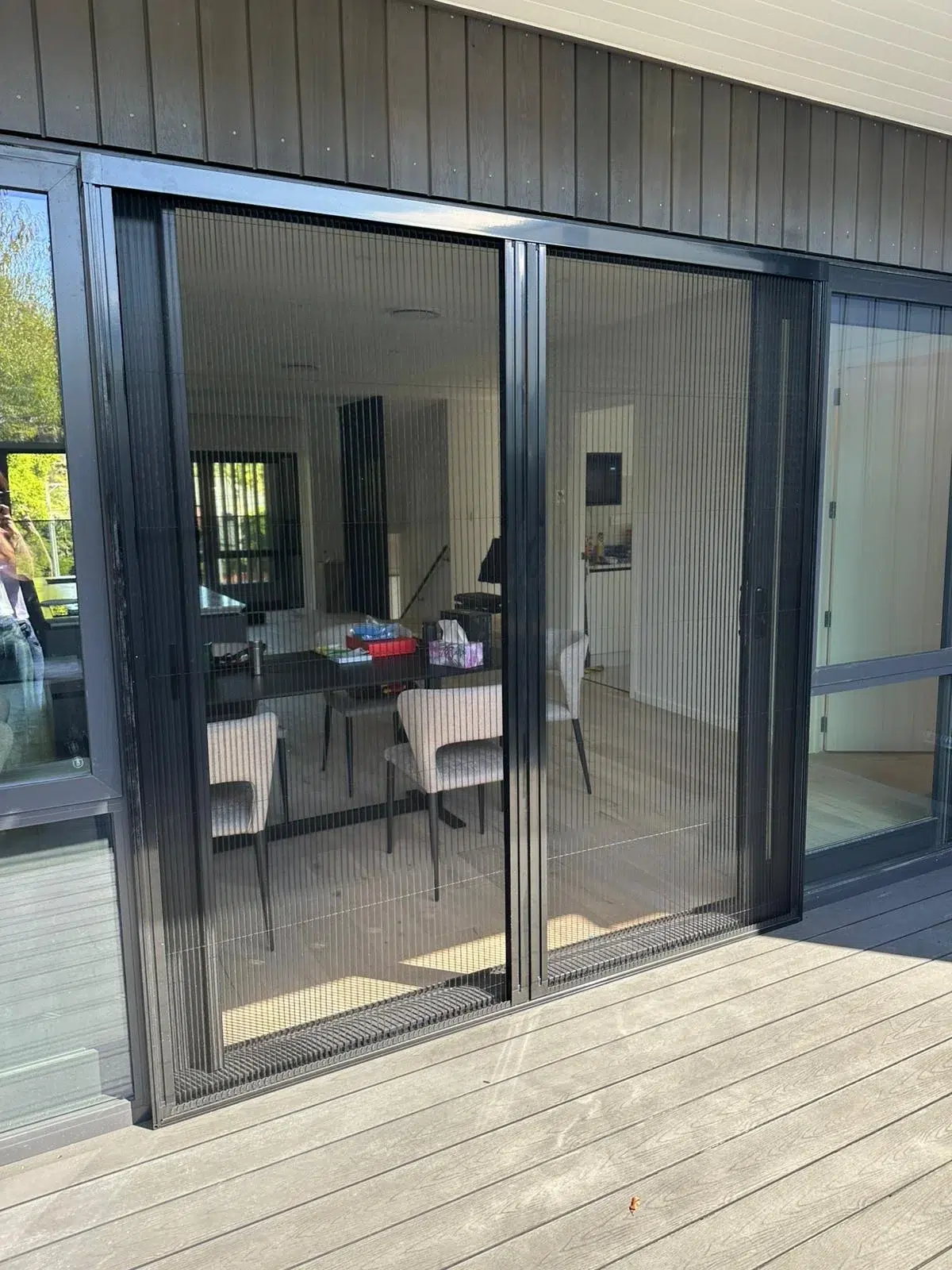 Double pleated retractable insect screen on a sliding door