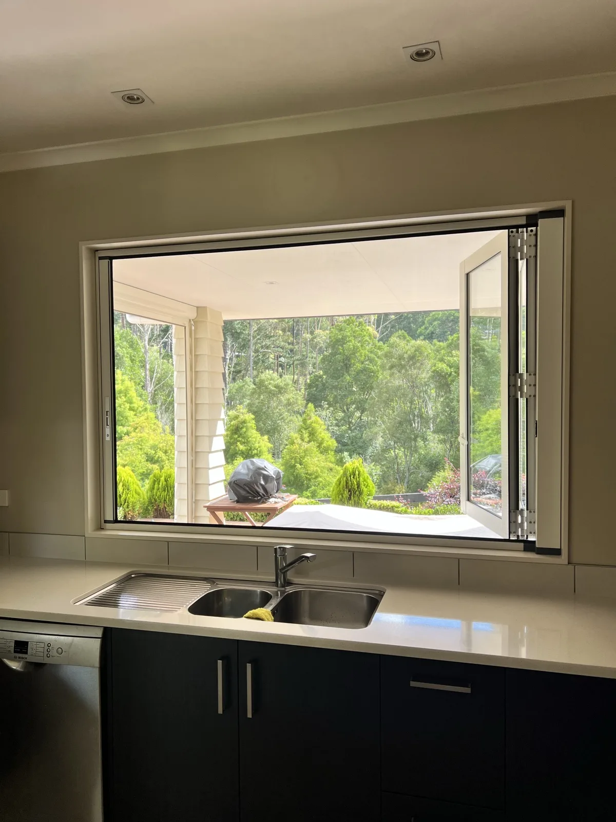 Fly screen on a kitchen servery window