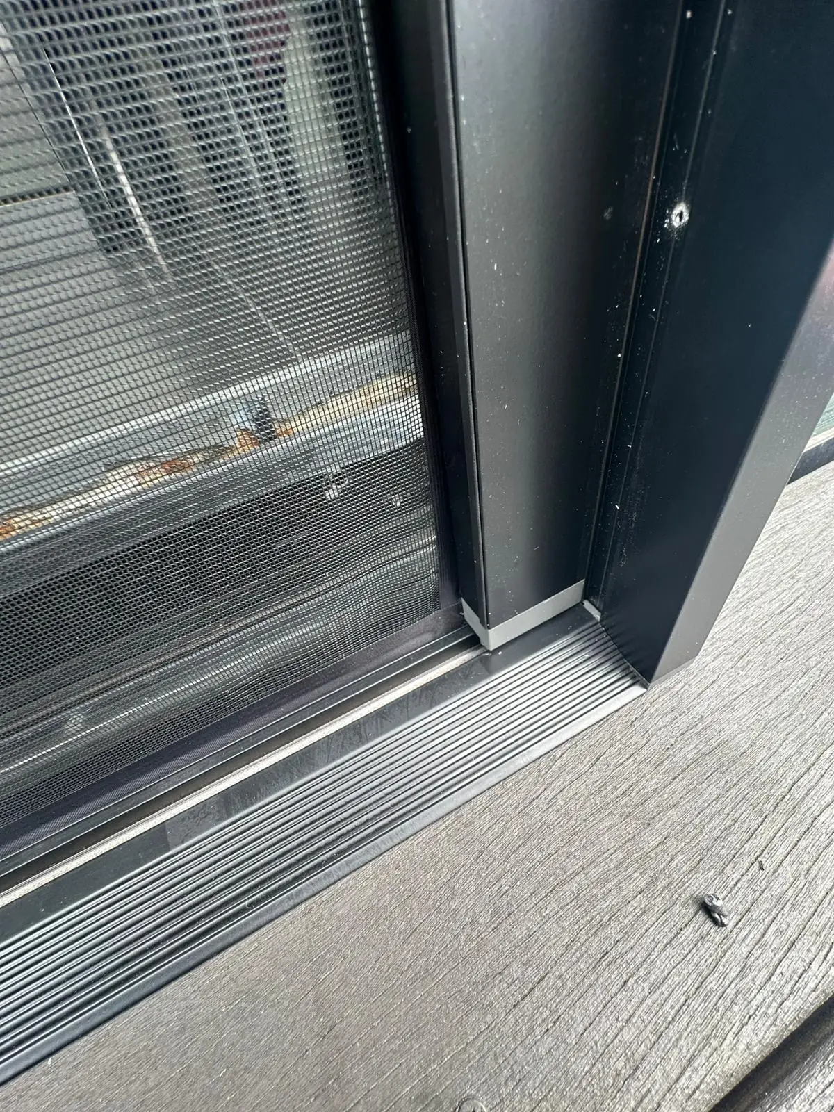 Sliding fly screen bottom track detail